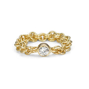 Yellow Gold chainmail ring with a single white diamond 