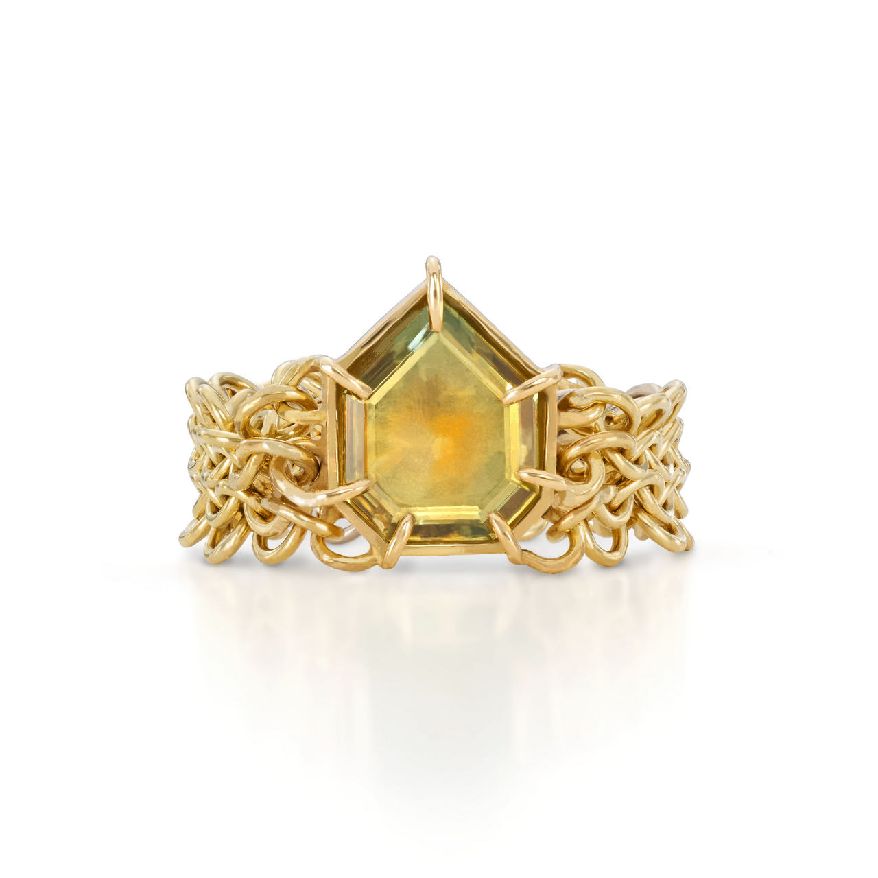 A gold ring featuring a square-cut green sapphire surrounded by yellow gold chainmail with white gold detailing on the back of the band.