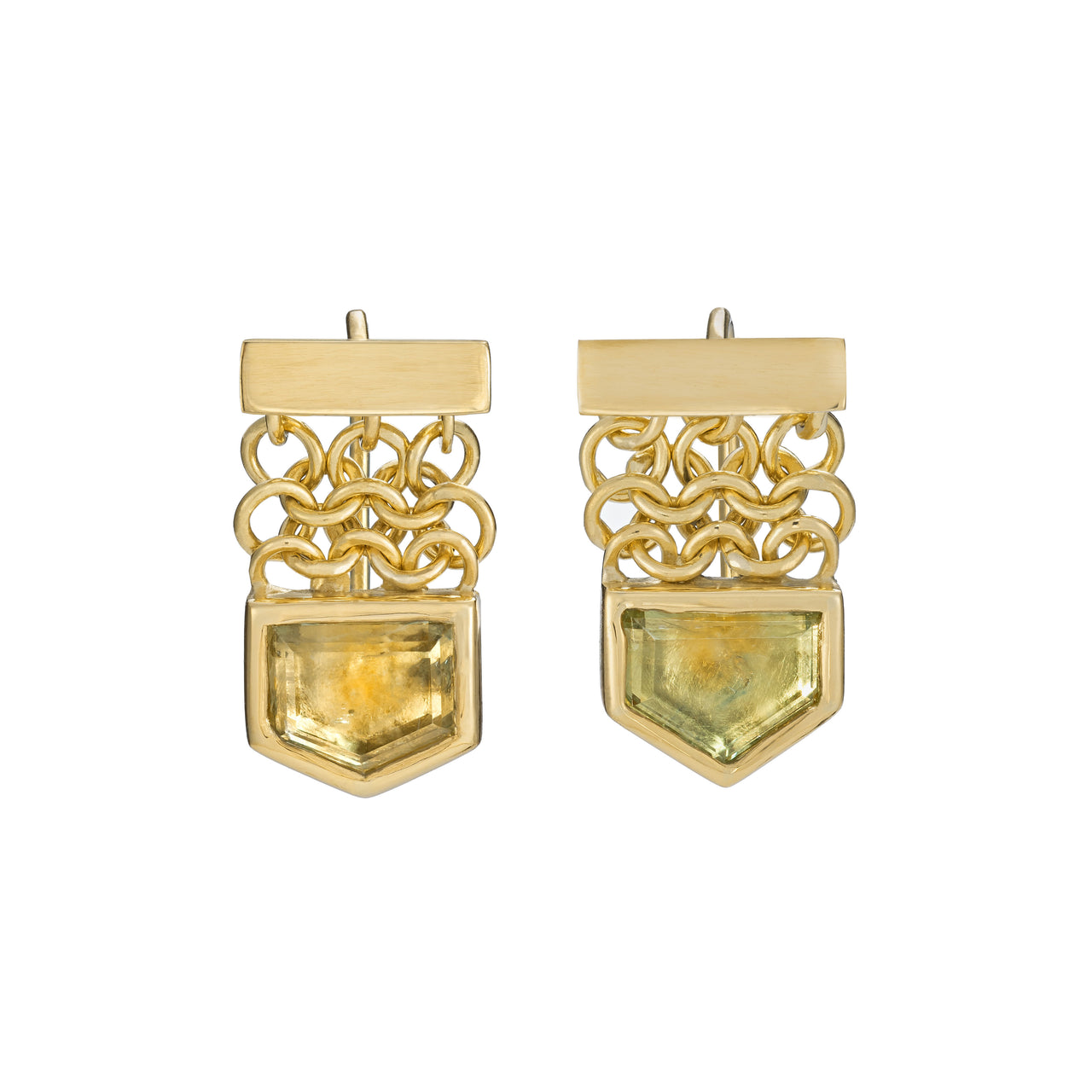 A pair of gold hook earrings featuring light green to gold sapphires, with a thin bar at the top  a small drop of gold chainmail and small hook fittings.