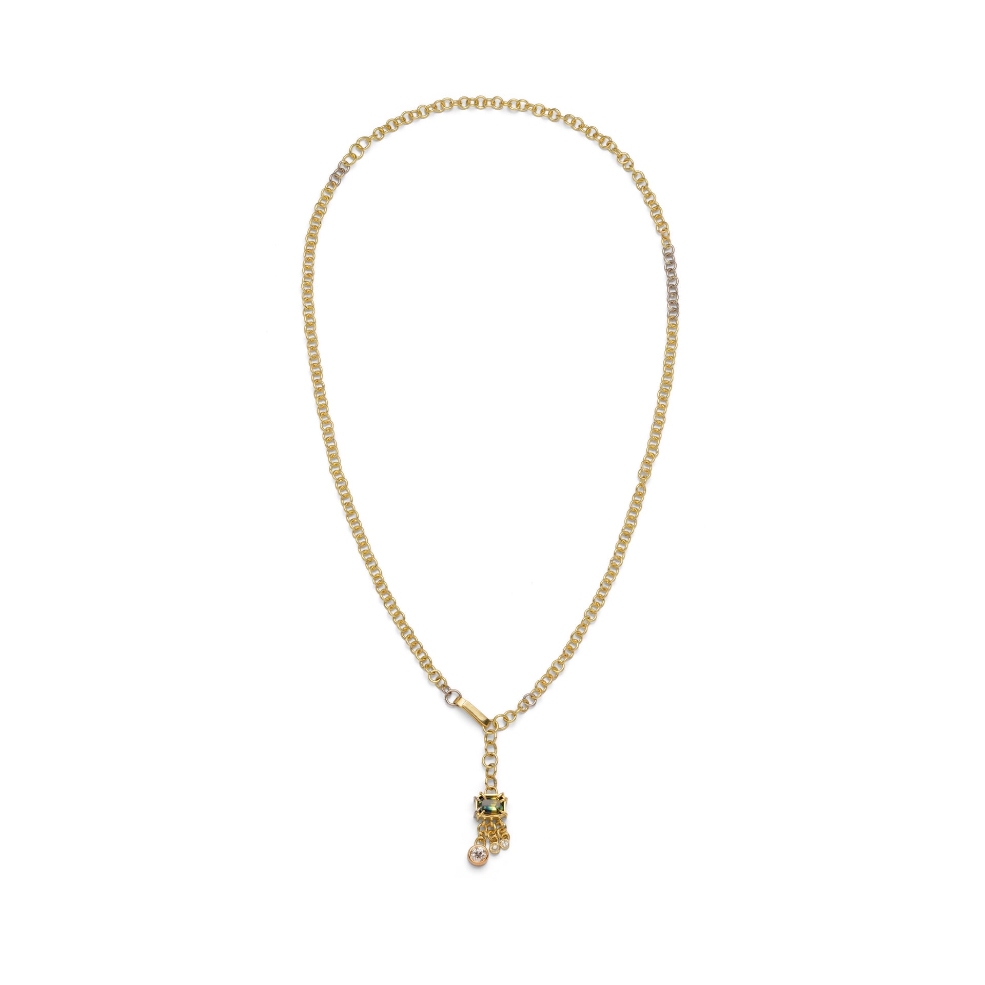 Yellow gold chain necklace long in length with a sleek solid gold hook clasp. a pendant of green sapphire square with three dangling diamond charms from the bottom. Claw set sapphire. elements of white gold interspersed around long neck chain