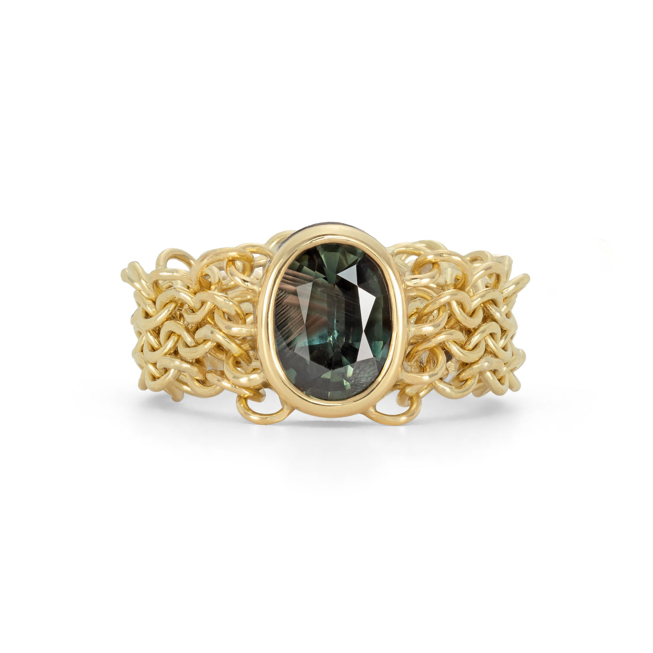 An 18ct yellow gold chain link ring featuring a large green oval natural sapphire gemstone, with intricate chainmail-like links making up the band.