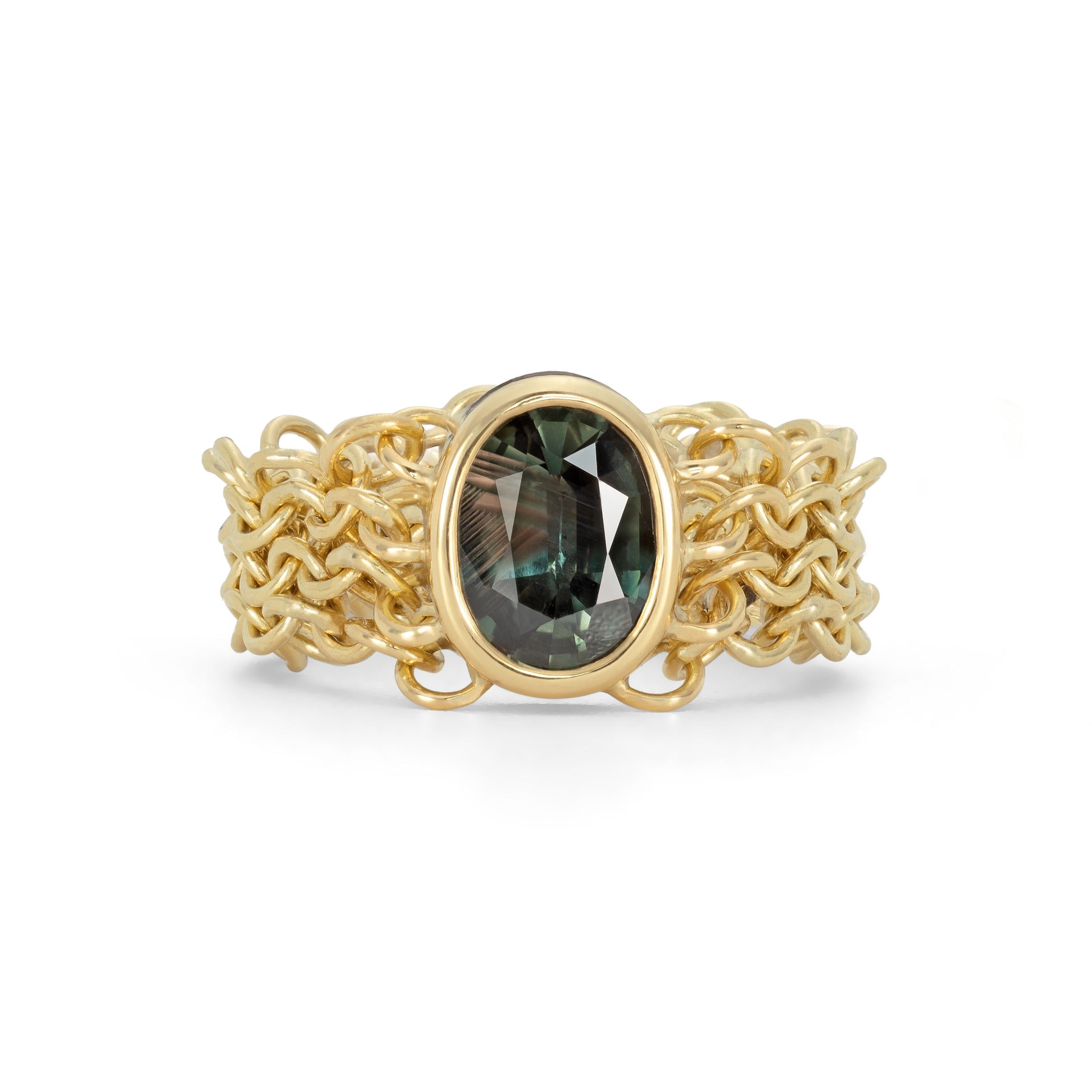An 18ct yellow gold chain link ring featuring a large green oval natural sapphire gemstone, with intricate chainmail-like links making up the band.