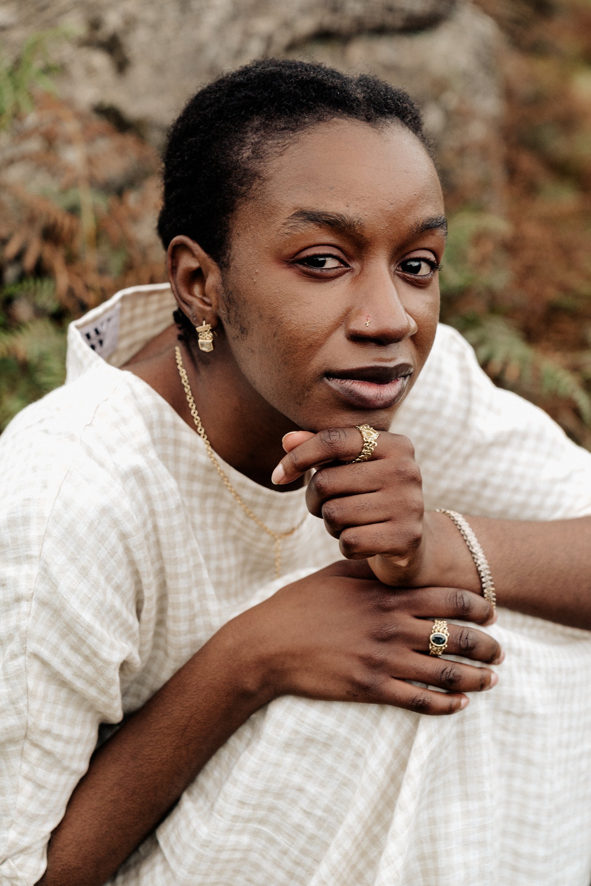 Yellow gold chainmail rings and earrings with green and Australian parti sapphires