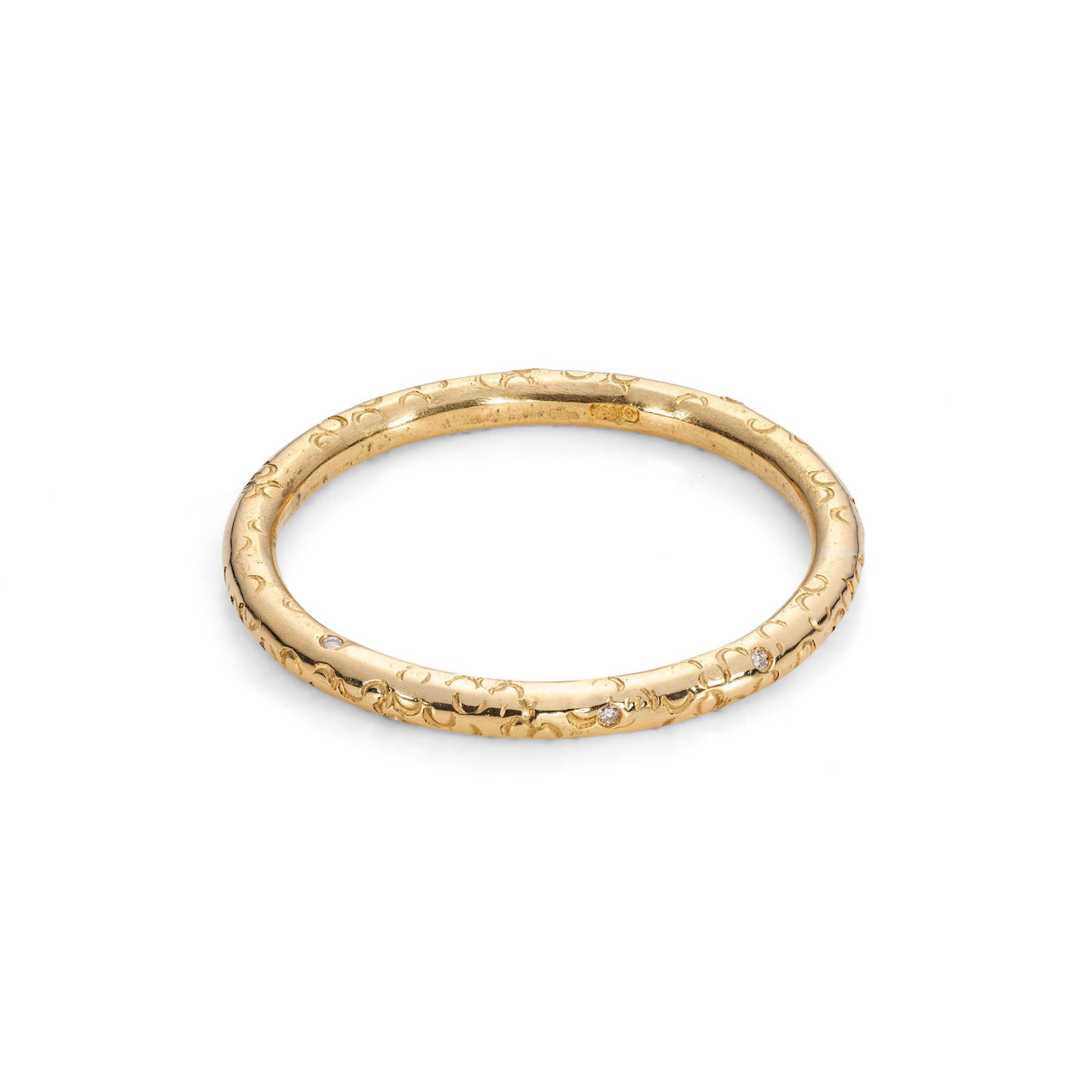 A yellow gold halo round ring wedding band with diamond accents on the band and a hand stamped texture around the whole ring