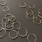 Wish Rings Fidget moving bead jewellery delicate gold and silver rings by Corrinne Eira Evans Contemporary Jewellery